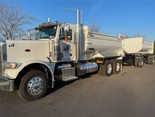 Transfer dump truck service for high-volume material hauling