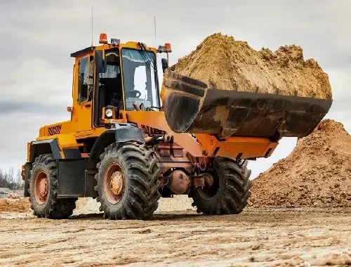 Wheel loader service for loading materials and job site support